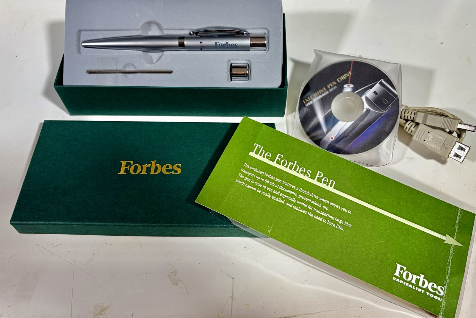 Forbes Capitalist Tool 64MB USB Flash Drive Pen Box CD Cable Vintage Tech