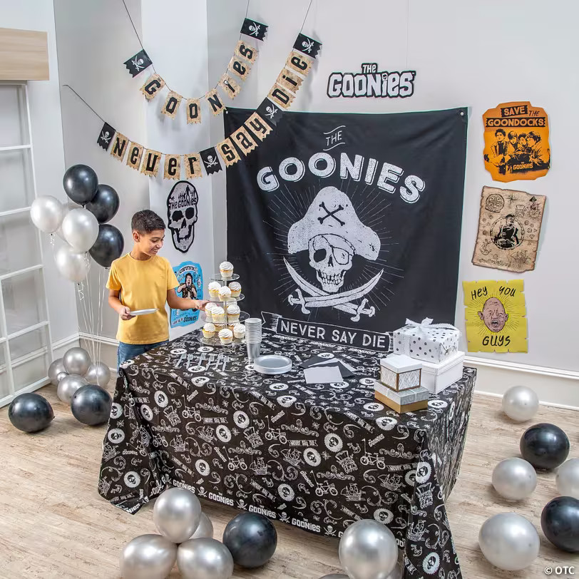 The Goonies™ Party Photobooth Backdrop & Wall Decorating Kit - 9 Pc. 14434685
