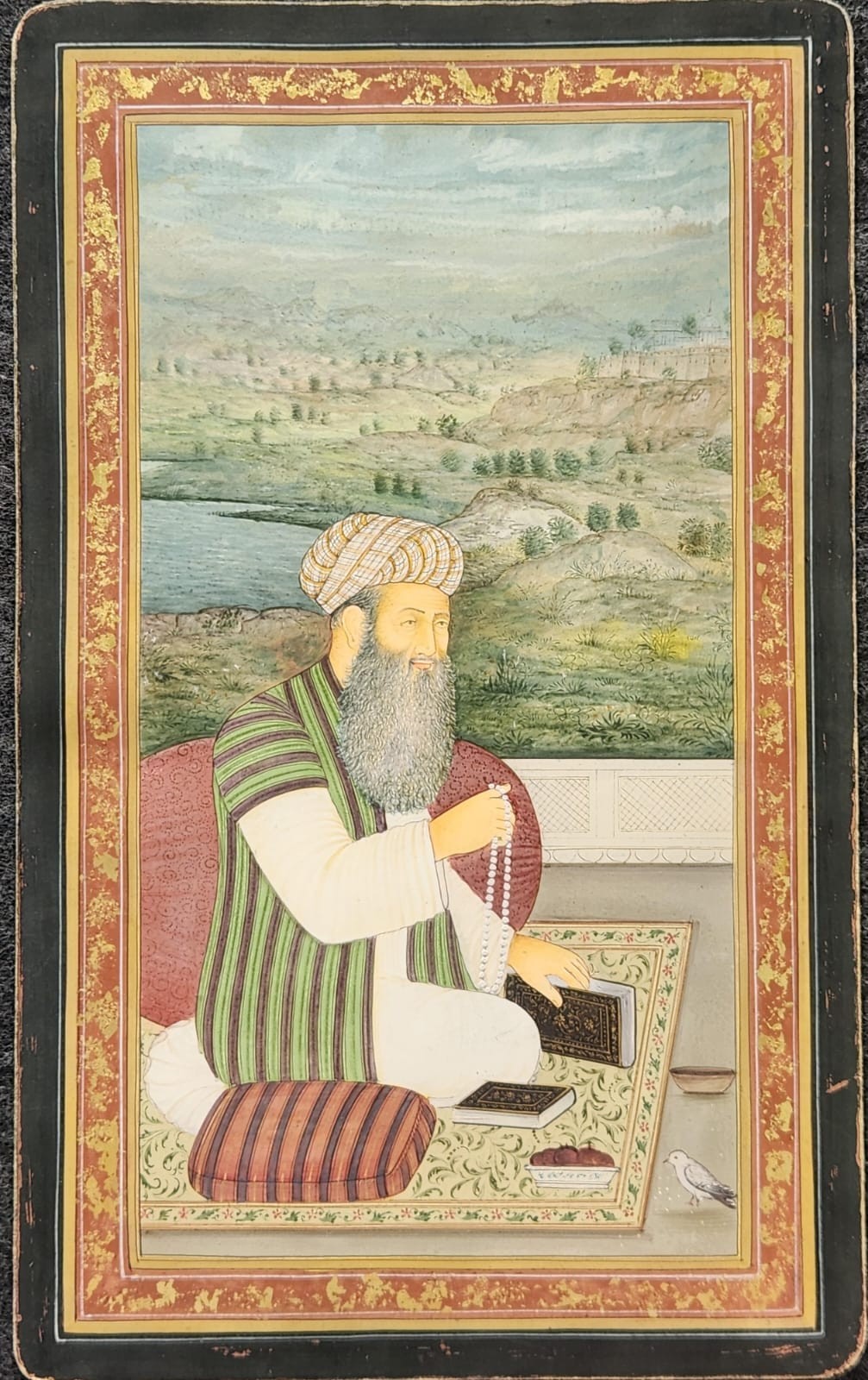 Mughal miniature painting on wasli depecting Seated Sufi Mystic in a Landscape 