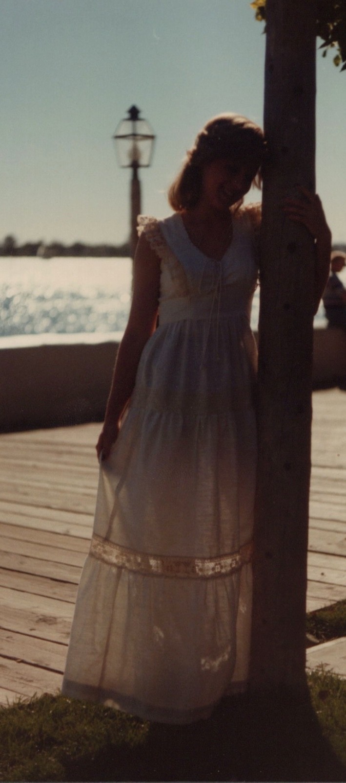 1980s Pretty Woman White Dress Waterfront Portrait Backlit Seaside Glamour