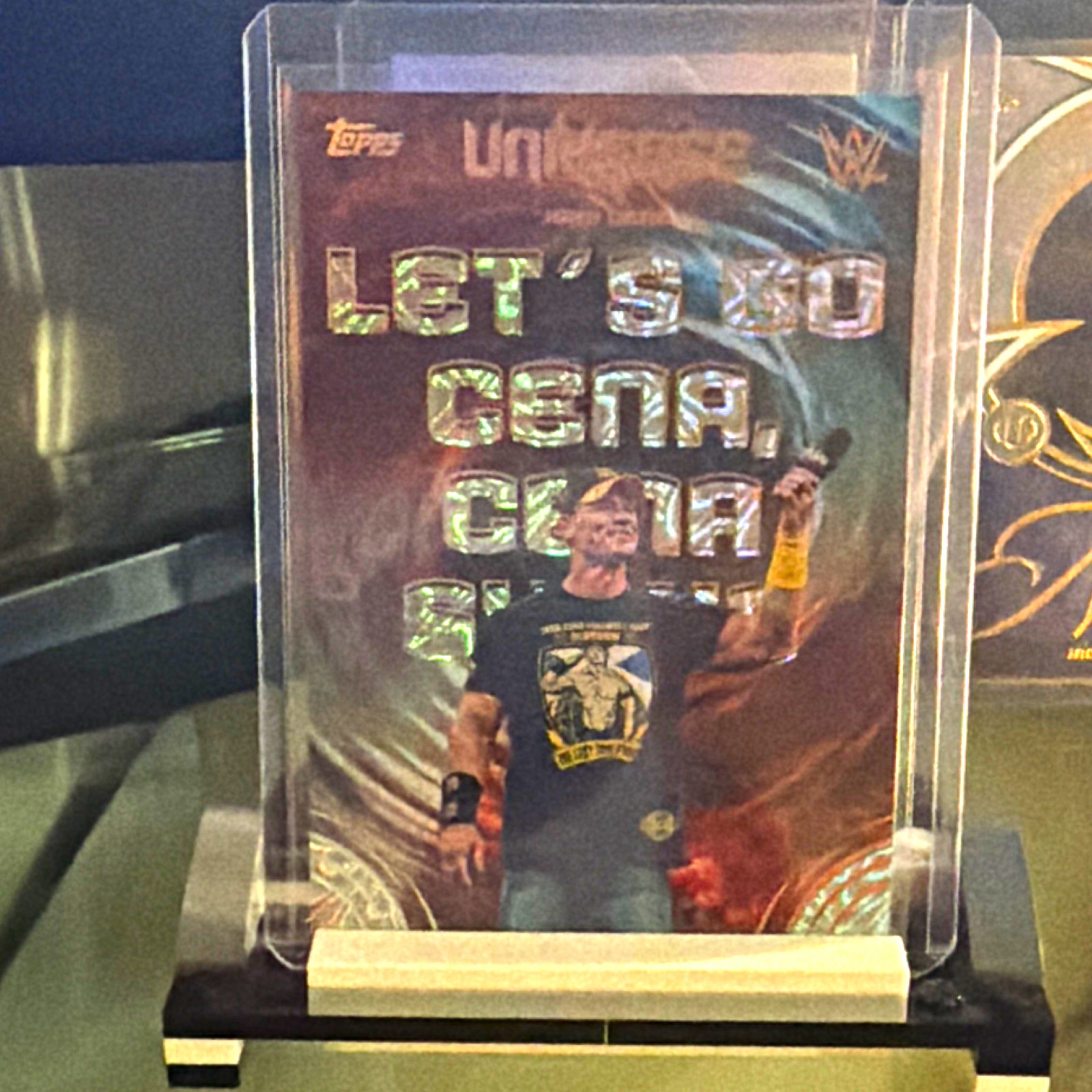 2026 Topps Universe WWE John Cena Echoes SP E-3 Let’s Go Cena, Cena, Sucks