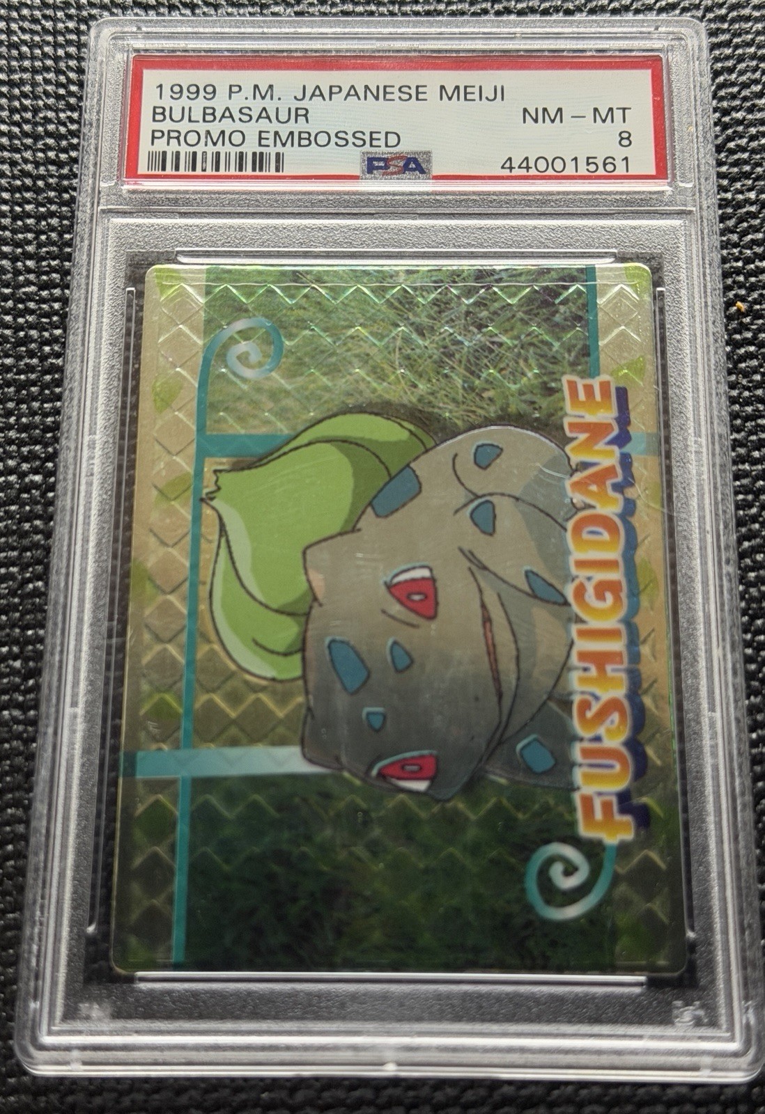 Meiji 1999 P.M. Japanese Meiji Bulbasaur Promo Embossed PSA 8