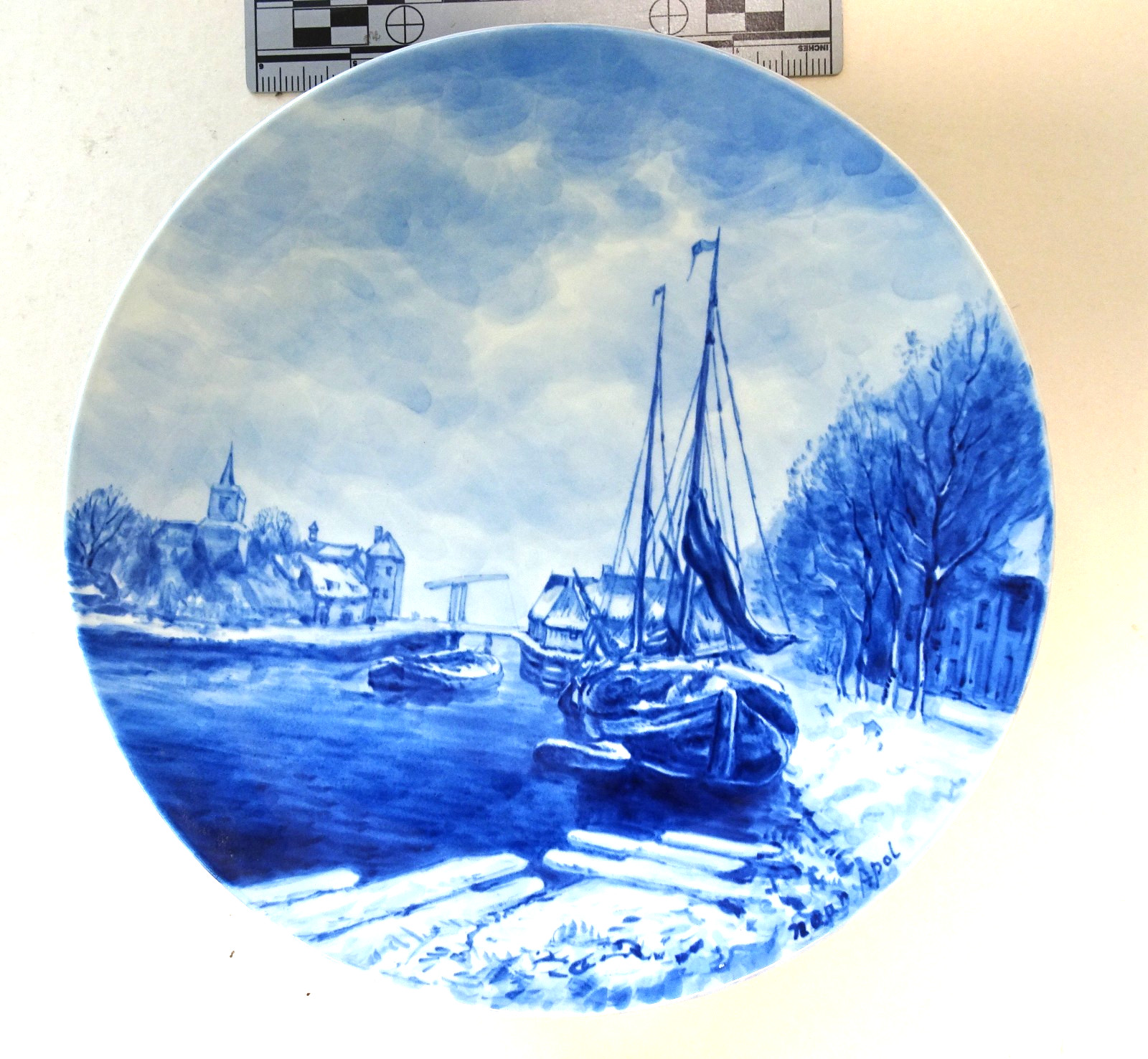 Blue Delft 9 1/2 inch 1976 plate depicting a Dutch canal scene by Apol