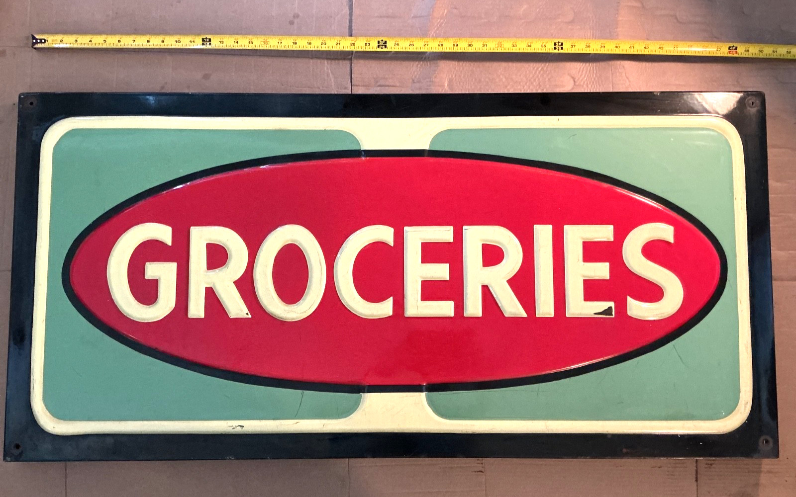 VINTAGE 1930’s-1950’s EMBOSSED PORCELAIN GROCERIES ADVERTISING SIGN - 24” X 50”