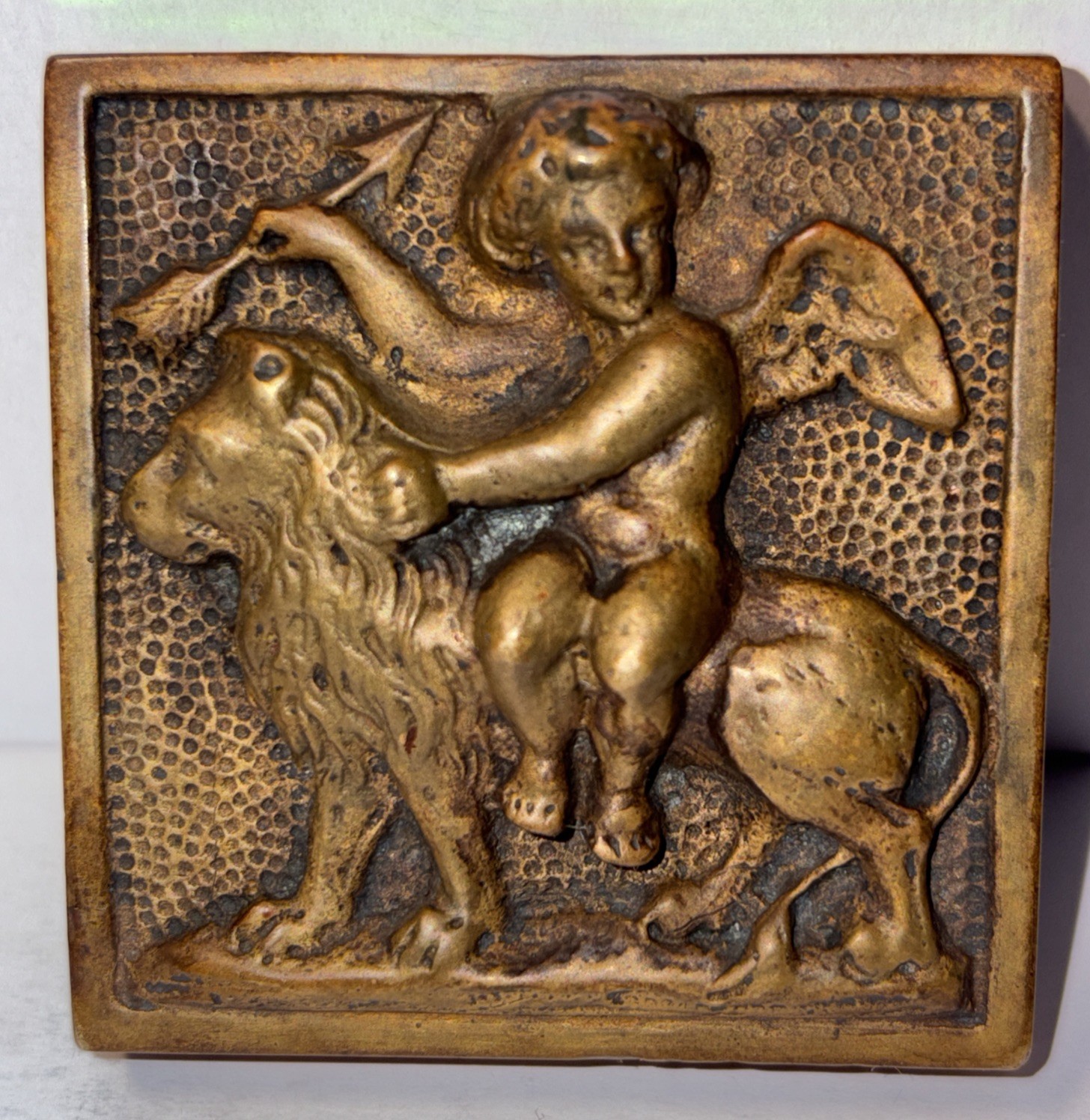Antique Arts & Crafts Cast Bronze Cupid Riding Lion Paperweight Relief 2 1/8”