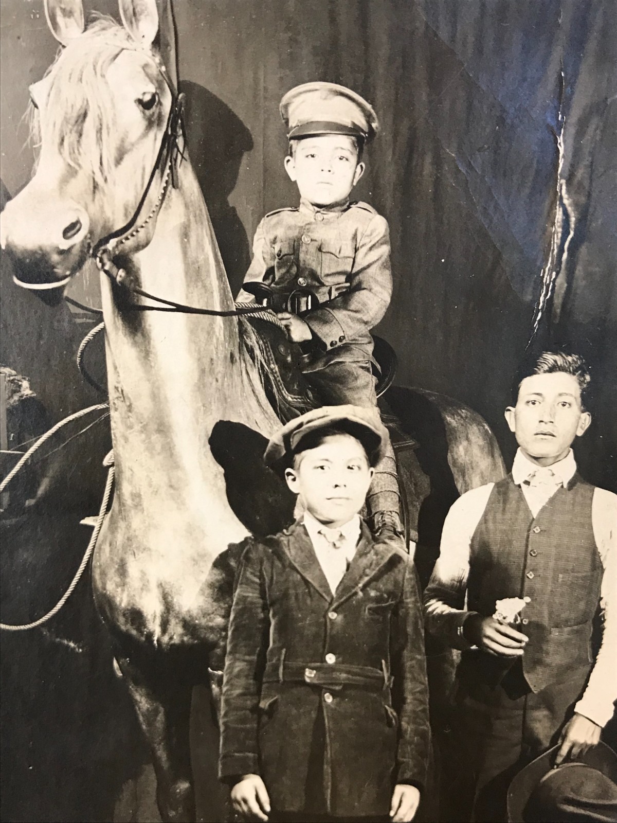 Antique Old RPPC Real Photo Postcard CHILD IN UNIFORM + STUFFED HORSE Weird 30\'s