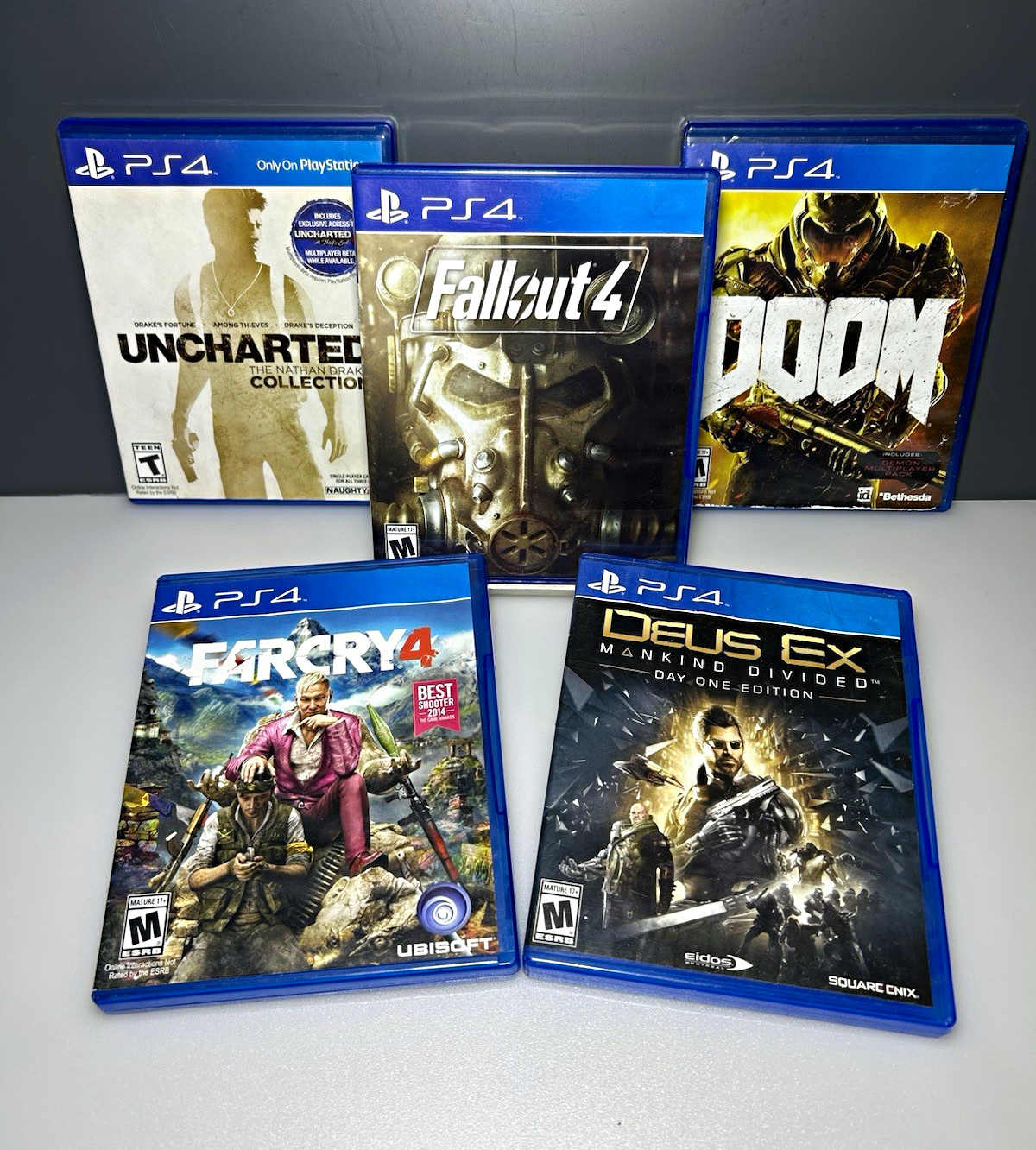 PS4) 5 Game Lot: Uncharted N.D. Collection, Fallout 4, DOOM, FARCRY4, DUES Ex