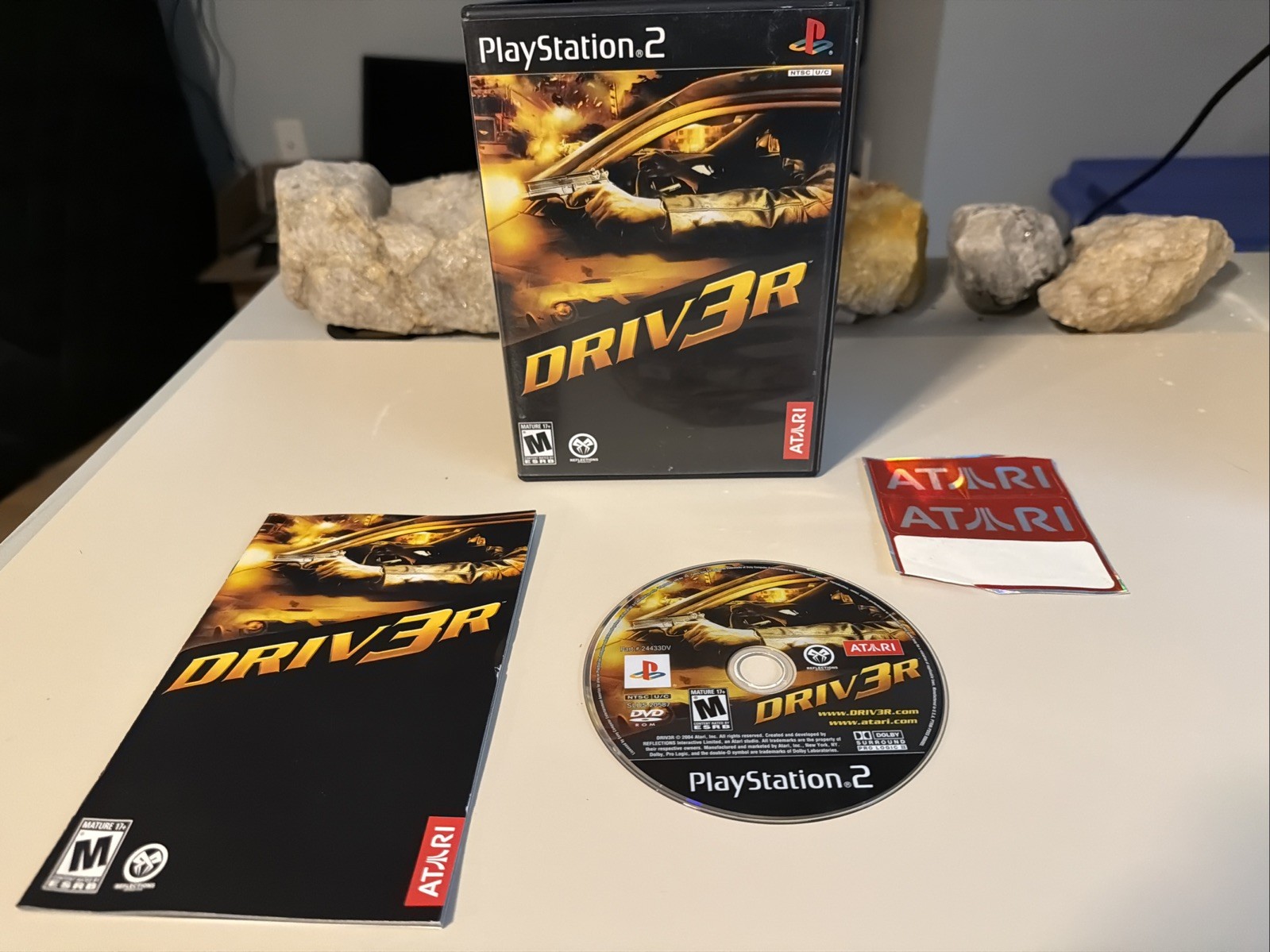 Driv3r (Sony PlayStation 2) Tested. CIB W/Atari Stickers. Lt Scratches On Disc.