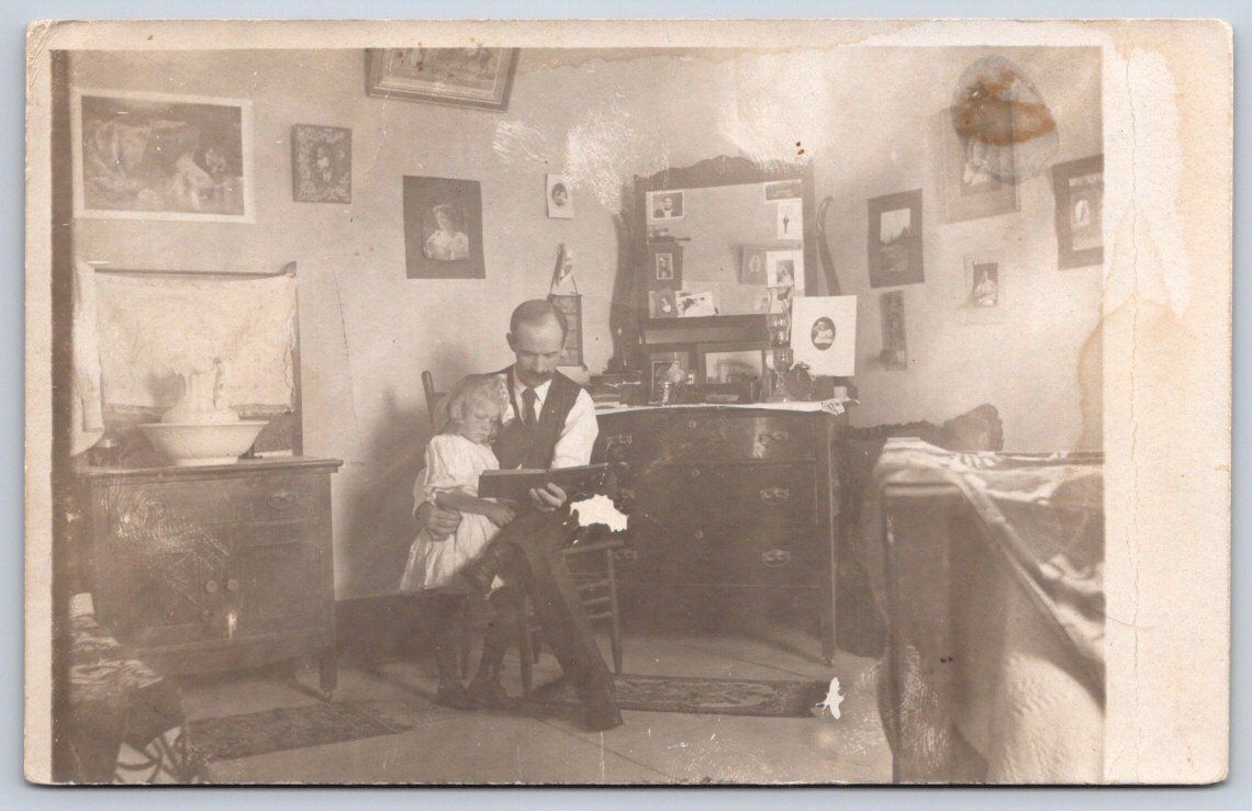 Antique Interior Scene Man Holding Child Reading Book 1905 RPPC
