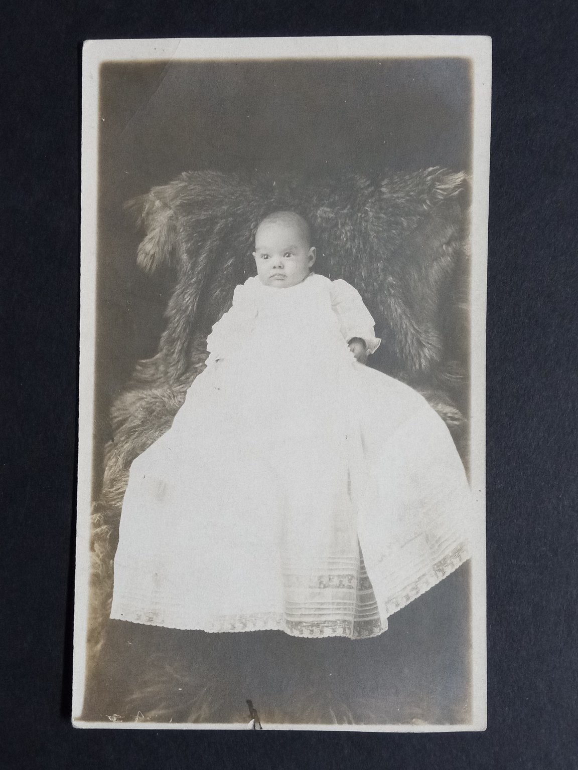 Antique RPPC Baby Portrait White Gown Fur Rug Vintage Real Photo Postcard
