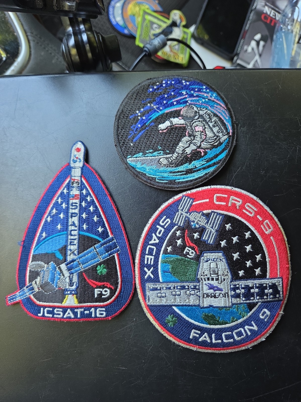 2 Space X  Falcon 9 Patches, 1 patch astronaut surfing