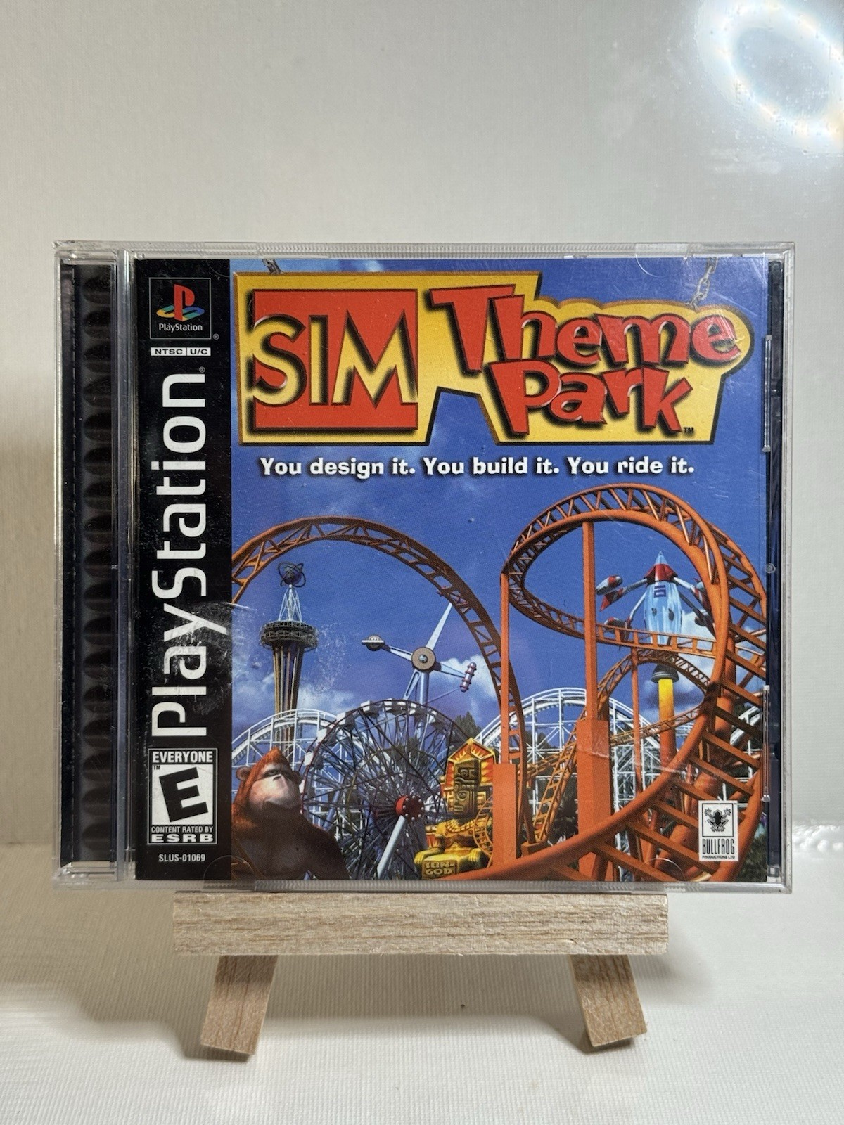 SIM Theme Park Sony PlayStation 1 PS1 2000 Black Label Complete W Red Card