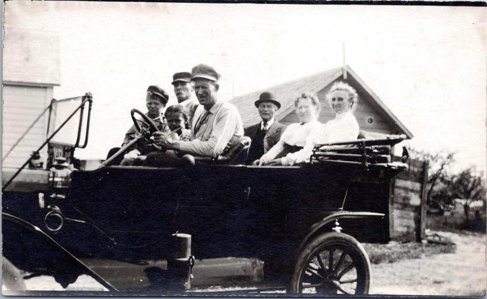 RPPC Seven People in Antique Automobile - Photo Postcard