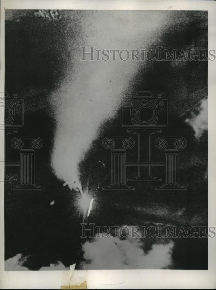 1944 Press Photo a German fighter plane careens to earth thru night sky, Europe