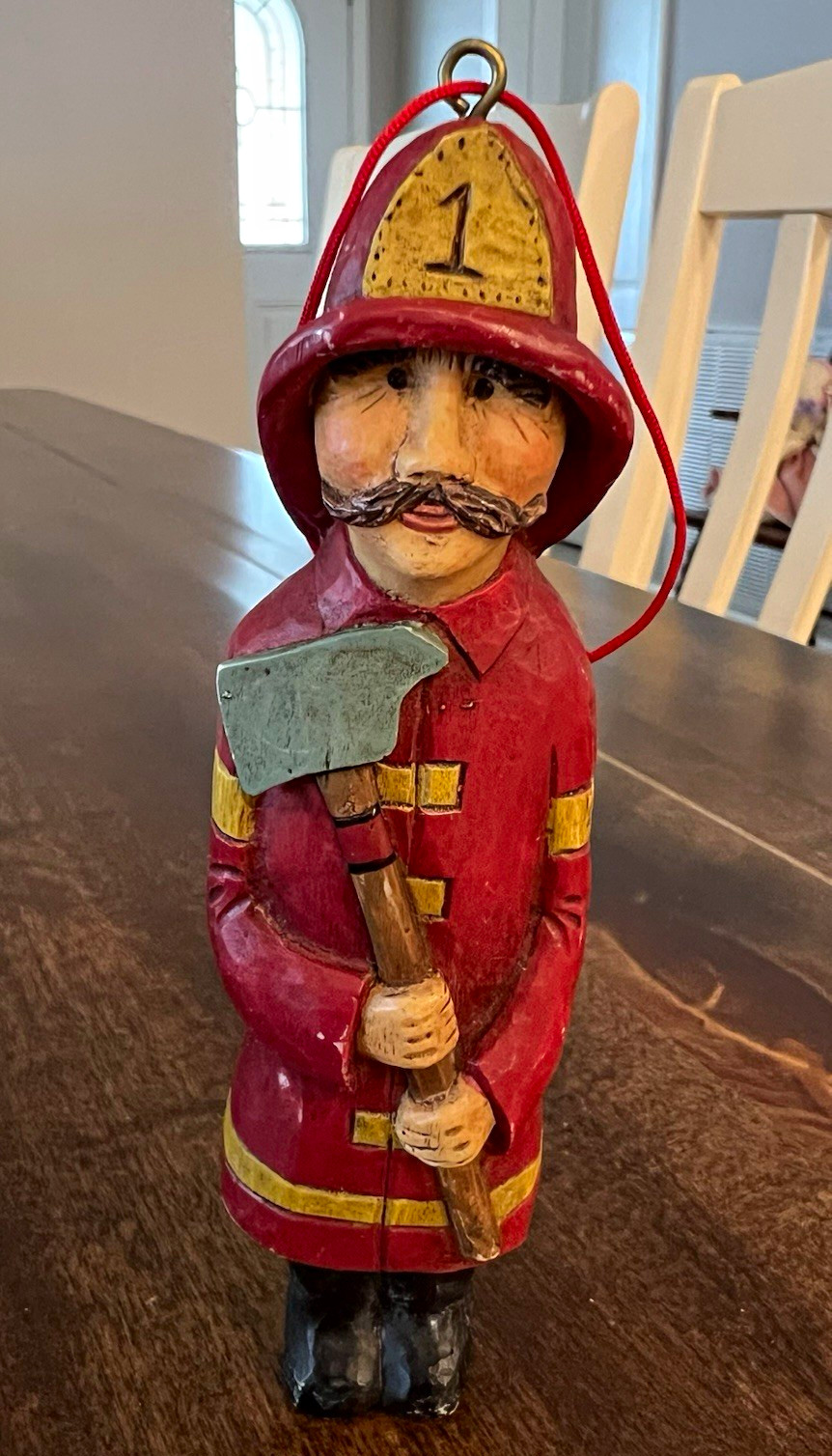 Vintage Kurt Adler carved-style resin firefighter Christmas tree ornament