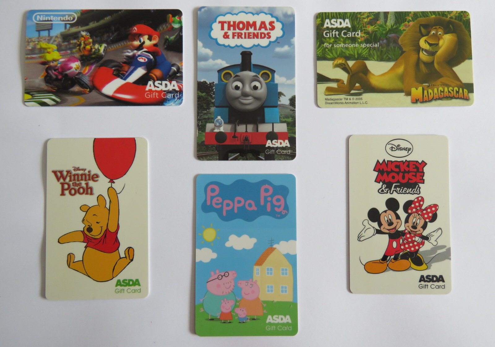 Asda Gift Cards x6 Mario Kart, Thomas, Madagascar, Winnie, Mickey Mouse etc