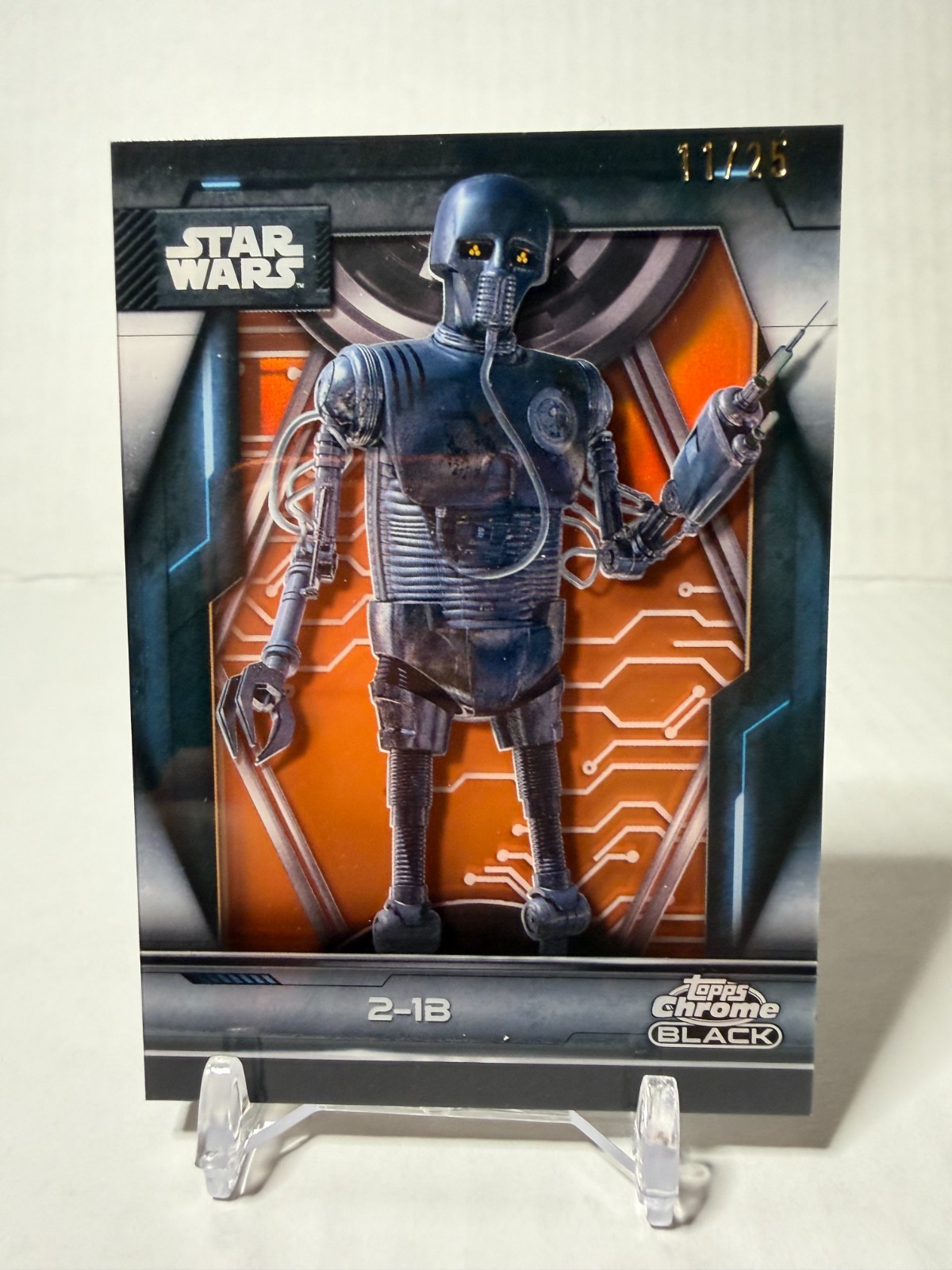 2025 Topps Droid Shadowbox (DS-17) Smugglers Outpost 2-1B Orange Refractor 11/25