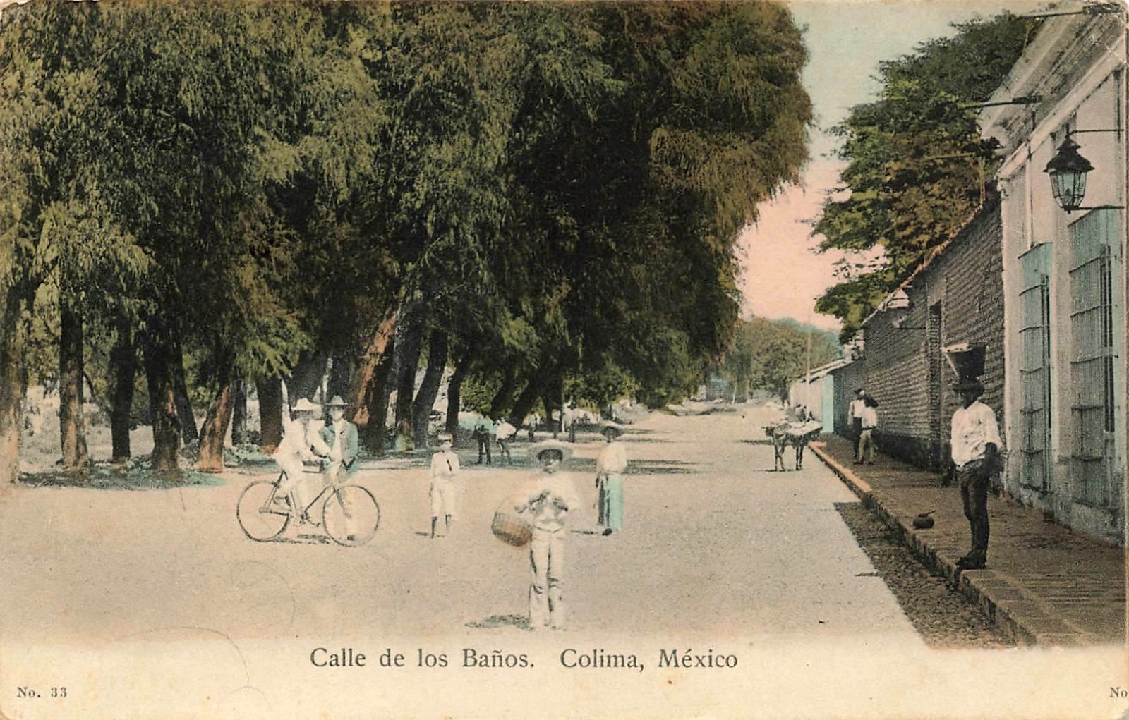 1914 MEXICO POSTCARD: LADY ON BIKE 7 KIDS ON BANOS STREET COLIMA, MEX.