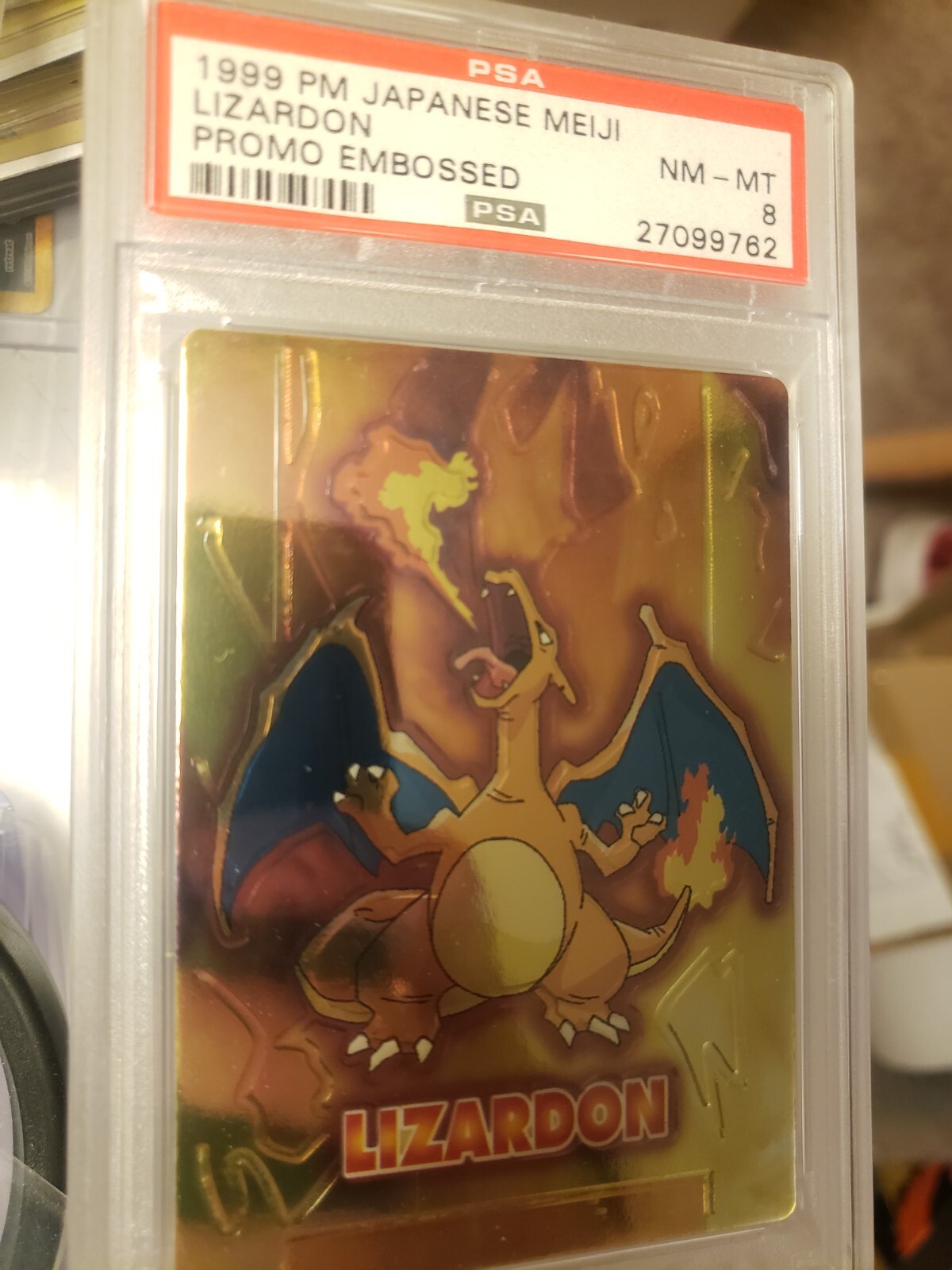 PSA 8 Charizard Meiji Embossed Lizardon 1999 Japanese promo Pokemon card