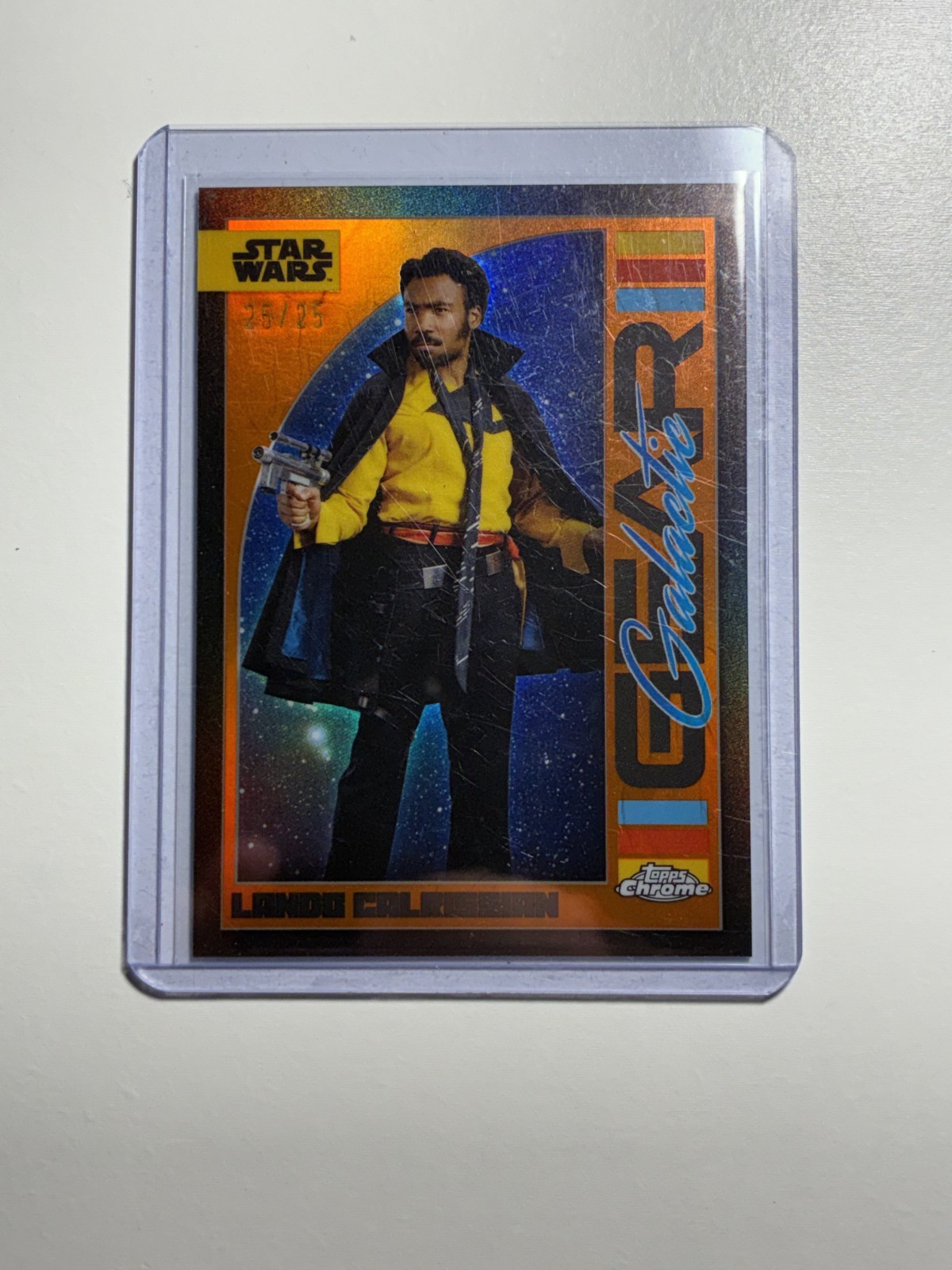 2024 Topps Chrome Lando Calrissian Galactic Gear #GG-15 Orange Refractor /25