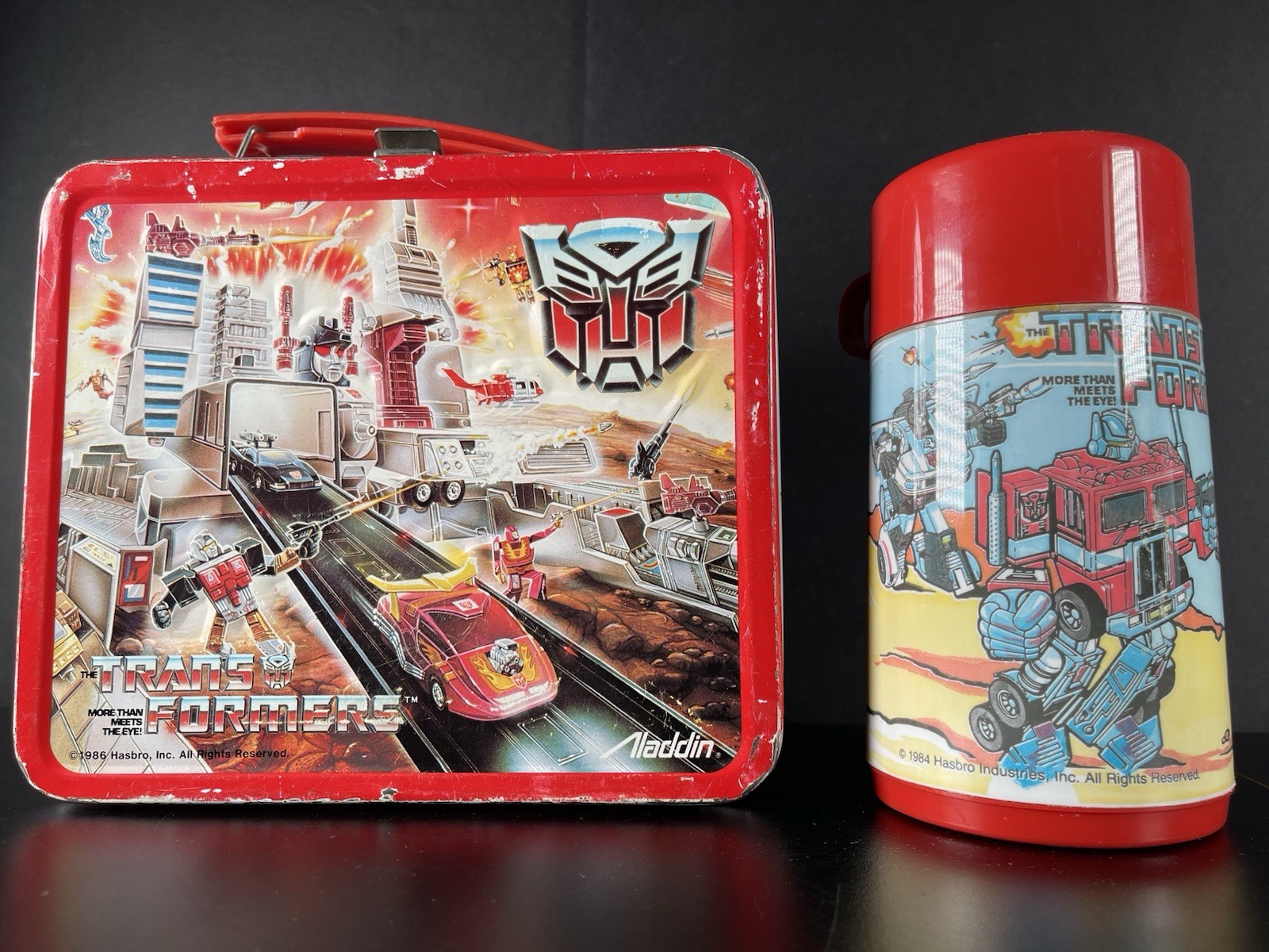 1986 Vintage Transformers Lunchbox Embossed Metal Aladdin USA Made Red Thermos