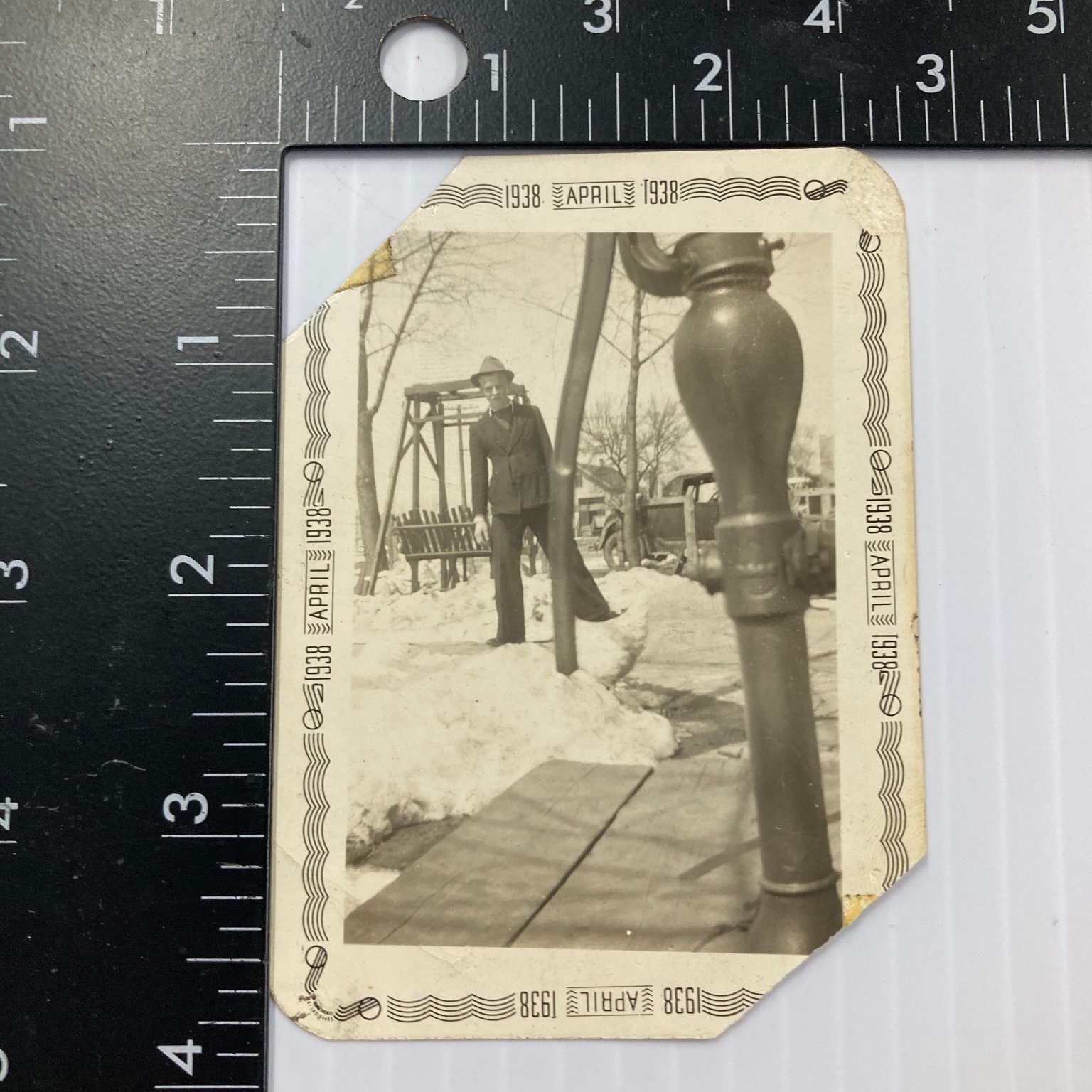 Man in Hat 1938 Snapshot Photograph Snowy Scene Swing Set Car Americana
