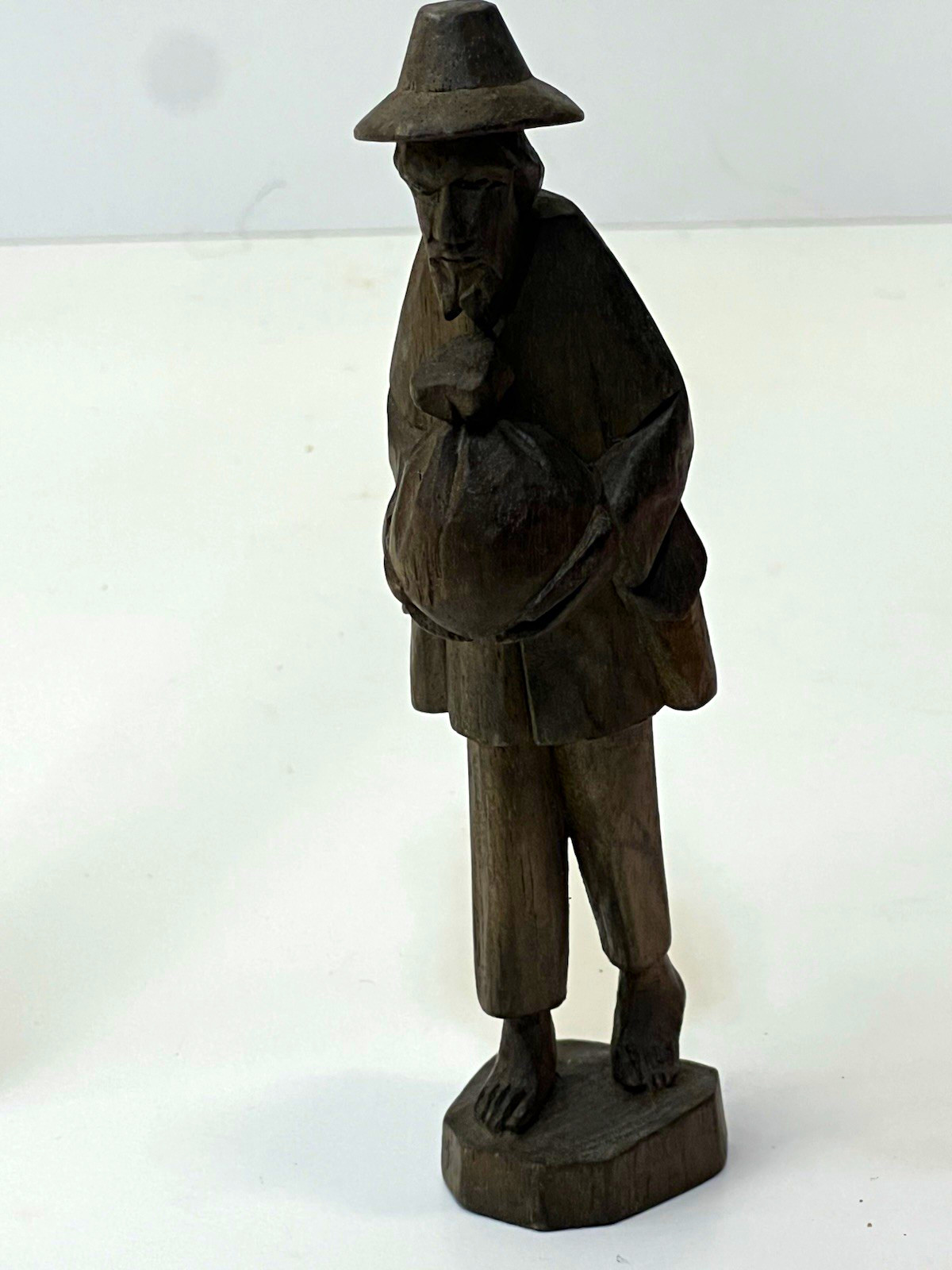 Vintage Carved Dark Wooden Barefoot Man Figurine Holding Sack Brown 6” Folk Art