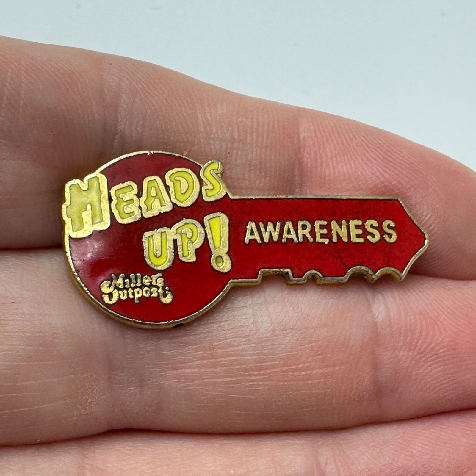 Millers Outpost Heads Up Awareness Key Shaped Employee Lapel Pin Clothing Store