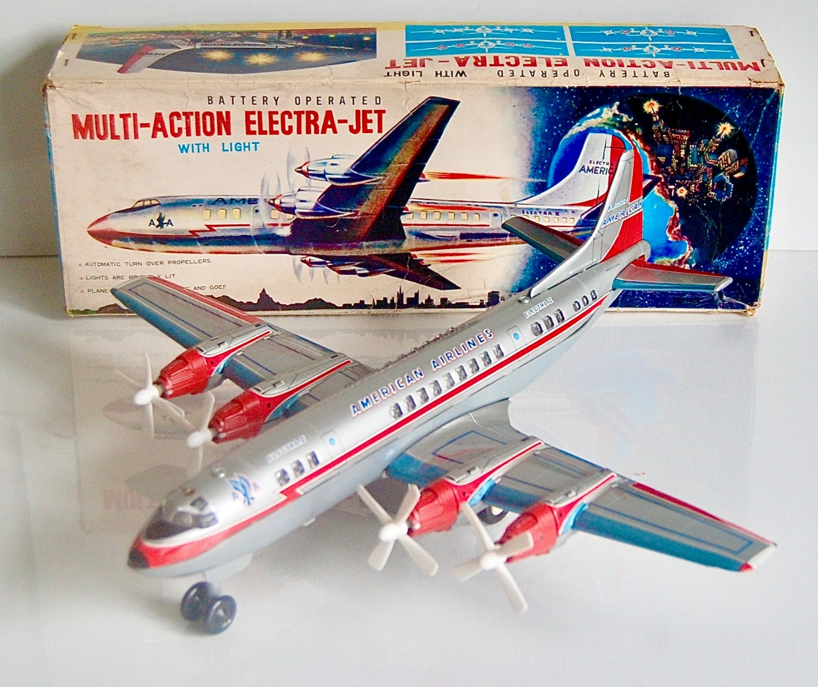 Yonezawa American Airlines Tinplate Electra Jet with light. Boxed. Fully working
