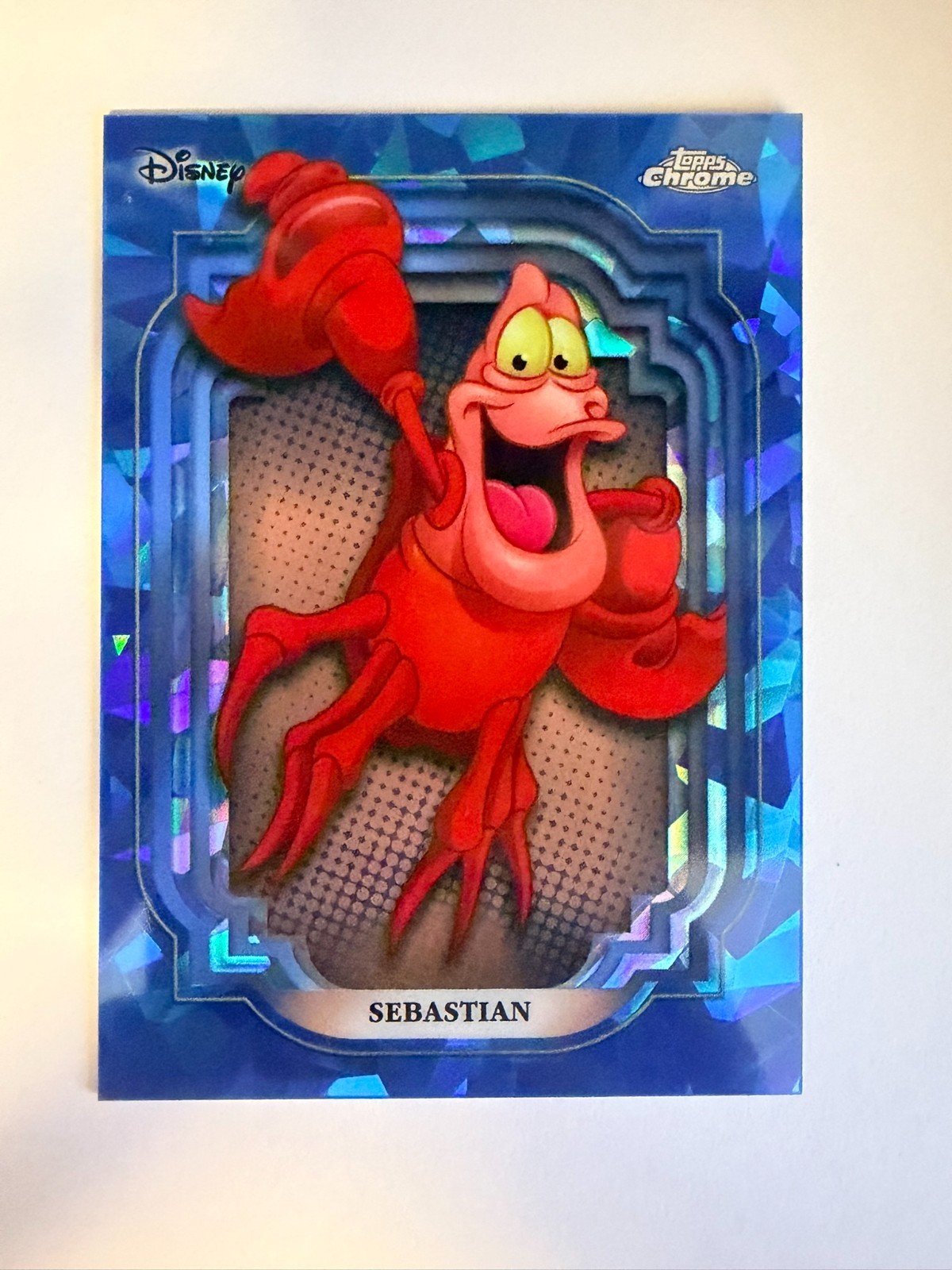 2024 Topps Chrome Disney Sapphire Sebastian #48 - 1st Year Sapphire