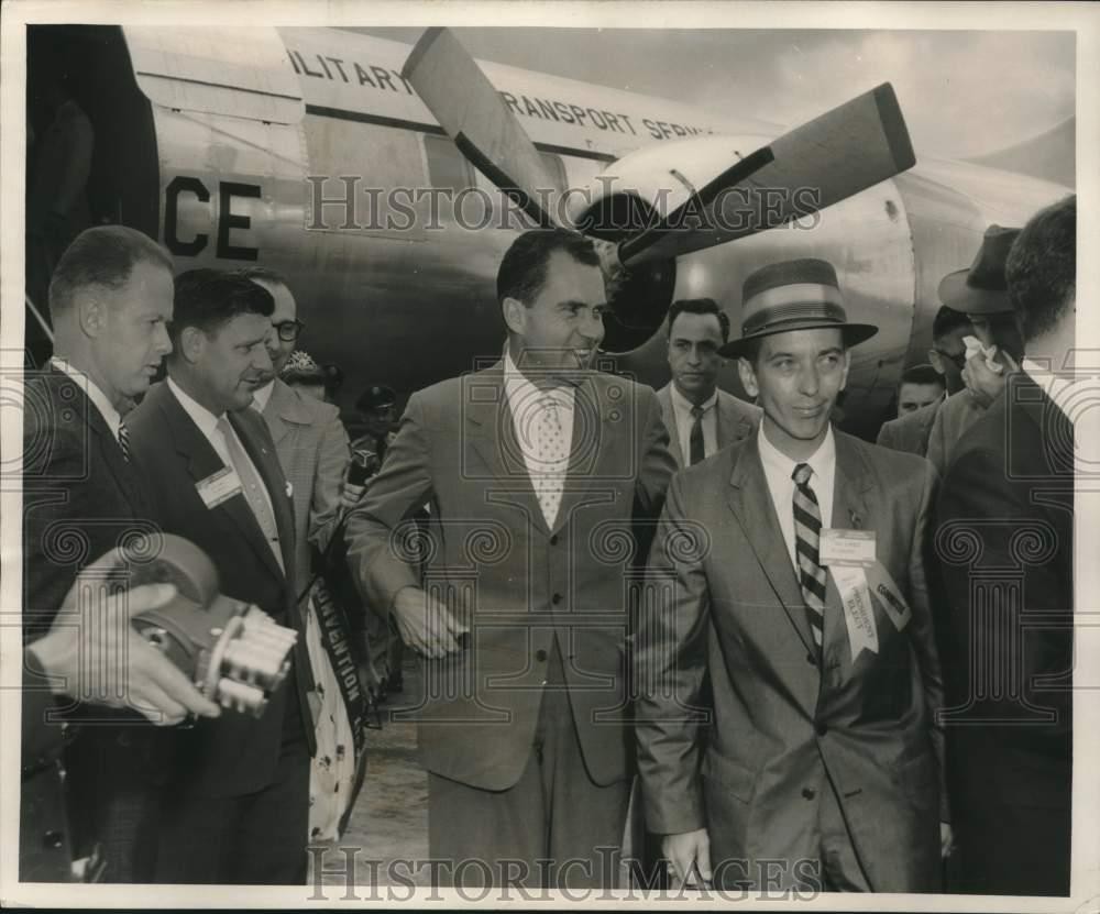 1957 Press Photo Richard Nixon at airport surrounded by cameramen. - mjx73225