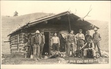 Cowboys at log cabin READY FOR THE HANGING STECKER Gilman Montana MT RPPC bhn picture