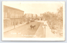 c1920 Calle 6a Street Scene H Matamoros Mexico RPPC Monte Carlo Cafe Beer Sign picture