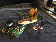 A wonderful Bedford Falls tree stand, Bert and Ernie figurines, taxi cab, car picture
