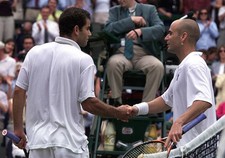America's Pete Sampras shakes hands with Andre Agassi after Sampra- Old Photo picture