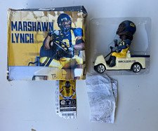 Forever Collectibles Marshawn Lynch Football Bobblehead Figure Golf Cart picture