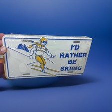 Vintage 1980s  Metal License Plate rare I’D Rather Be Skiing sealed Saab Subaru  picture