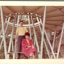 c1960s Couple Mid Century Shelter Snapshot Yellow Shirt Red Coat Vtg Photo picture