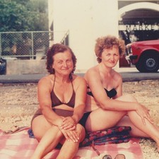 Two Curvy Women Sitting Together In Bikini Swimsuits By Sea Beach Vintage Photo picture