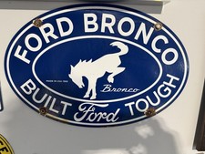 Vintage Ford Bronco Built Ford Tough Metal Sign Blue White Oval Made in USA 1966 picture