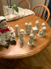 Precious moments figures and sailor picture