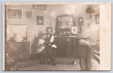 Antique Interior Scene Man Holding Child Reading Book 1905 RPPC picture