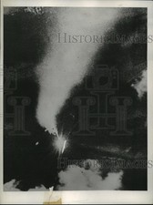 1944 Press Photo a German fighter plane careens to earth thru night sky, Europe picture
