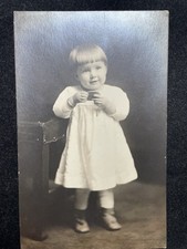 CUTE GIRL WITH COOKIE ANTIQUE REAL PHOTO POSTCARD CIRCA 1910 P122 picture