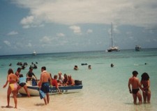Vibrant Beach Day Colorful Swimsuits Boats in Background 1980s-90s Fun picture
