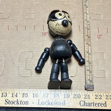 This is an antique, jointed wooden and composition Felix the Cat toy, 1920s picture