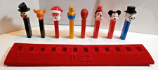 Vintage PEZ NO FEET Red Felt Display Stand For 12 PEZ Lot Scrooge Rudolph Mickey picture
