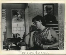 1962 Press Photo Havana hotel guest on phone in hotel lobby after raider attack picture