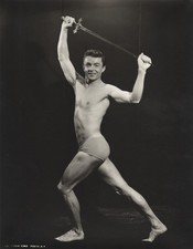c. 1950's Bodybuilder Holding Sword Overhead Large Photograph by SAL TERRACINA picture