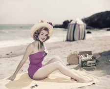 Young woman in swimwear at beach portrait smiling Historic 1960s Old Photo picture